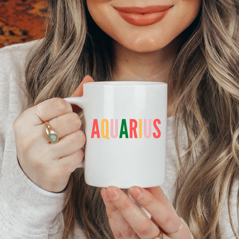 Aquarius 11 ounce multi-color text mug